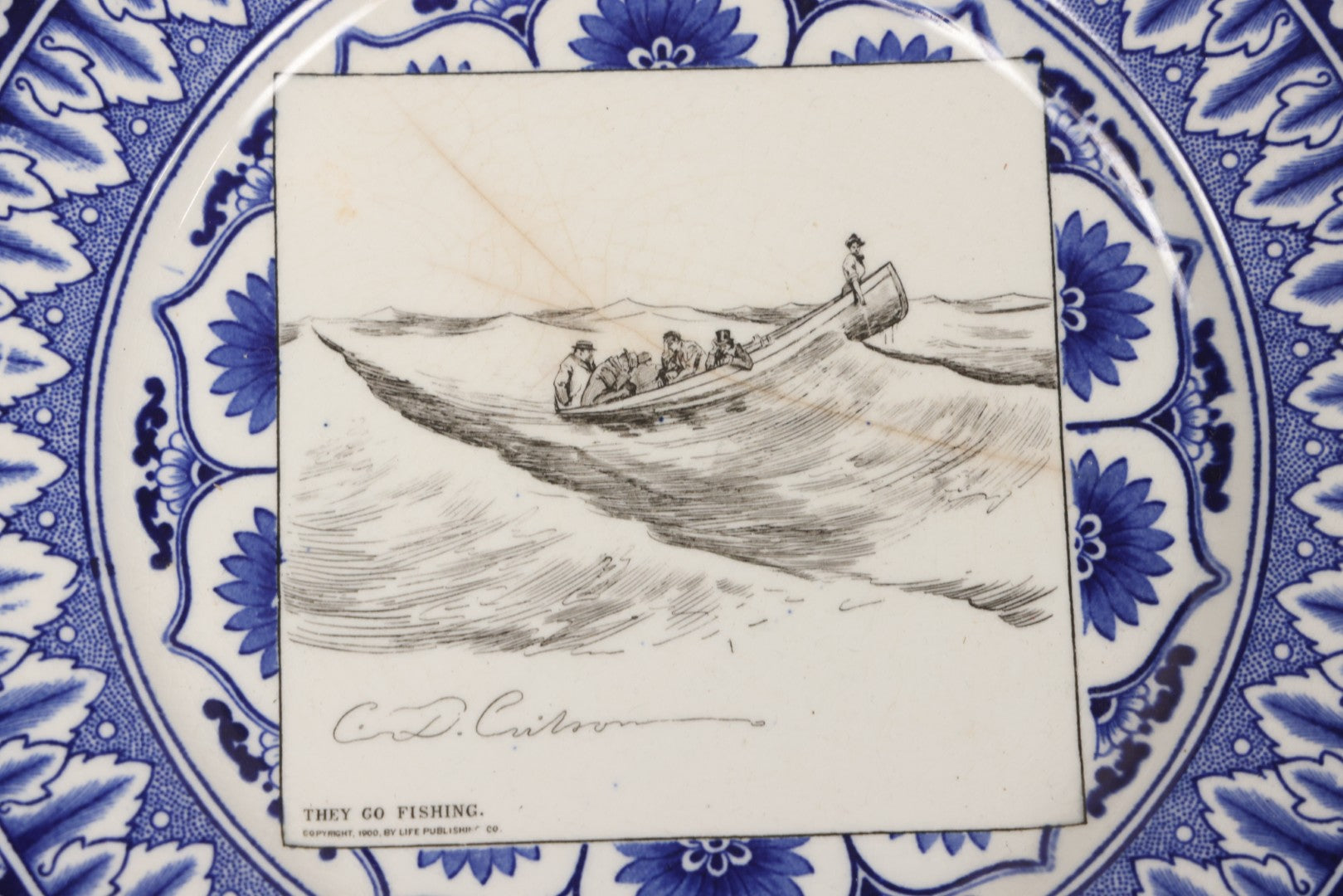 Lot 153 - Pair Of Antique Royal Doulton Decorative Plates With Life Publishing Co. Scenes By Charles Dana Gibson, 1900–1901, Including "They Go Fishing" And "She Goes To The Fancy Dress Ball As 'Juliet'," 10-1/2" Diameter Each