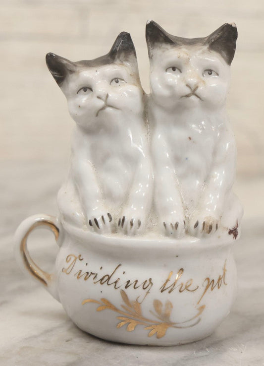 Lot 155 - Antique Porcelain Figure Of Two Cats On Cup, "Dividing The Pot" Gilt Lettering, 3-3/4" H