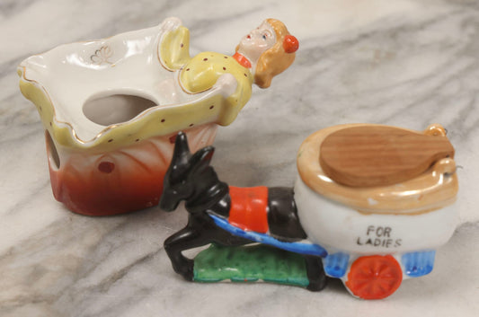 Lot 156 - Pair Of Vintage Novelty Porcelain Ashtrays — Woman Lifting Dress, Marked Patent T.T., And Donkey Pulling Toilet “For Ladies,” Made In Japan
