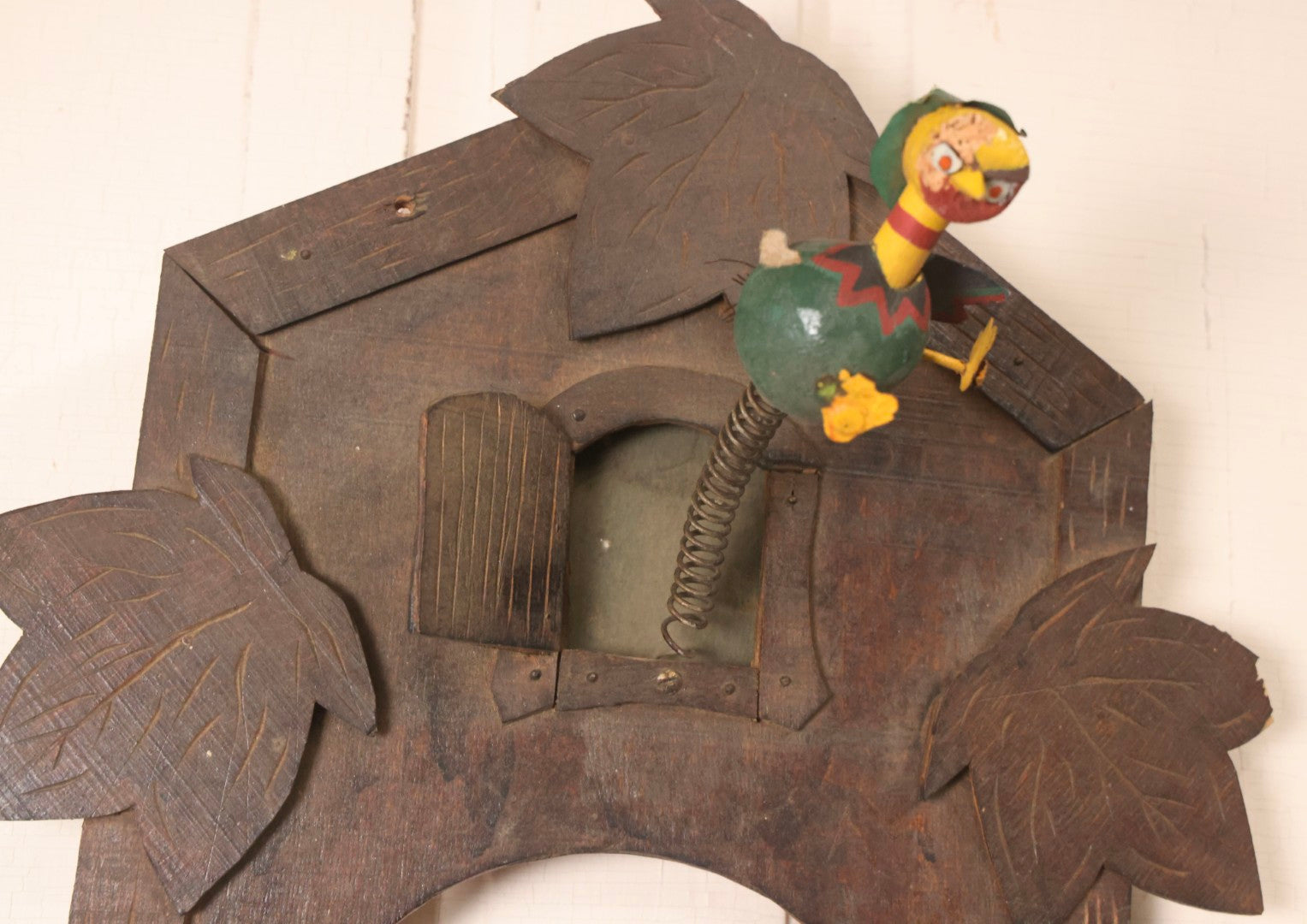 Lot 163 - Antique Folk Art Wooden Cuckoo Clock Cover With Spring-Mounted Cuckoo And Gilt Pine Cone Weights