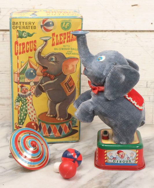 Lot 176 - Vintage Rosko-Steele Battery-Operated Circus Elephant Toy With Blowing Ball And Parasol, In Original Box, Made In Japan, Working Condition