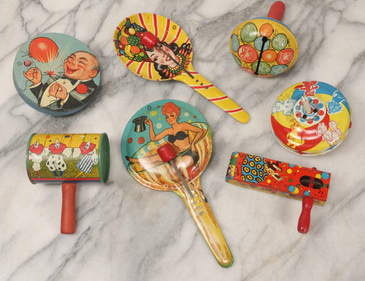 Lot 179 - Grouping Of Seven Vintage And Antique Tin Lithograph Noisemaker Toys Including Dancing Clowns, Woman In Martini Glass, Party Scenes, And Animal Top