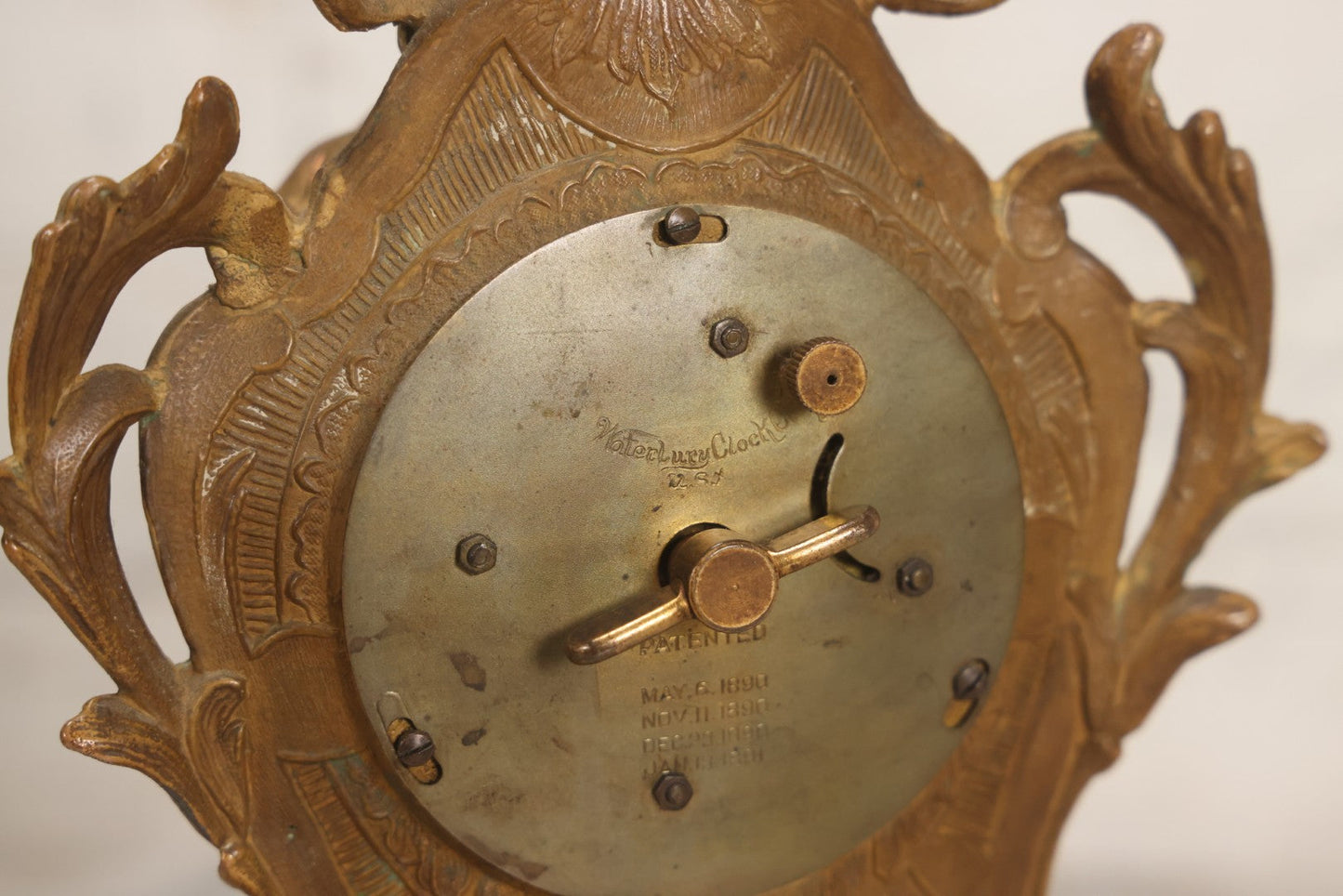 Lot 012 - Antique Waterbury Clock Co. Gold-Painted Spelter Mantel Clock With Hand-Painted Dial And Cupid Scene Panel, Circa 1890s Working Condition, 11" H