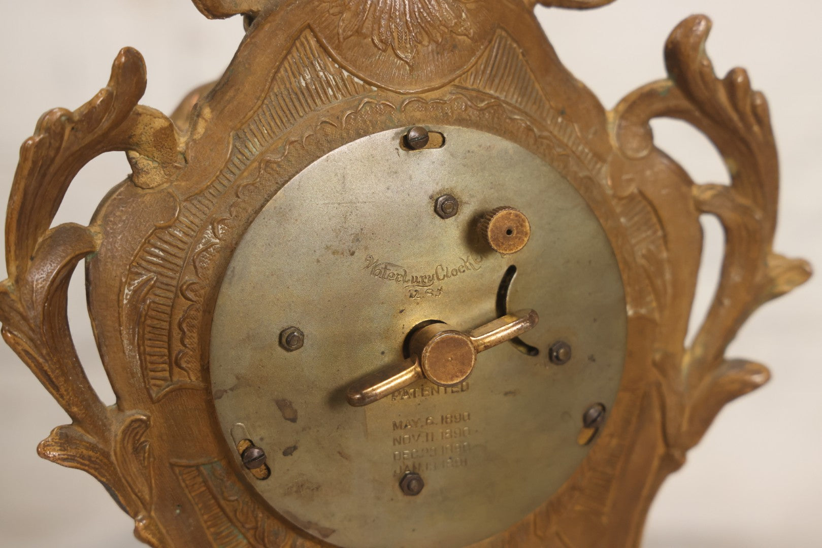 Lot 012 - Antique Waterbury Clock Co. Gold-Painted Spelter Mantel Clock With Hand-Painted Dial And Cupid Scene Panel, Circa 1890s Working Condition, 11" H