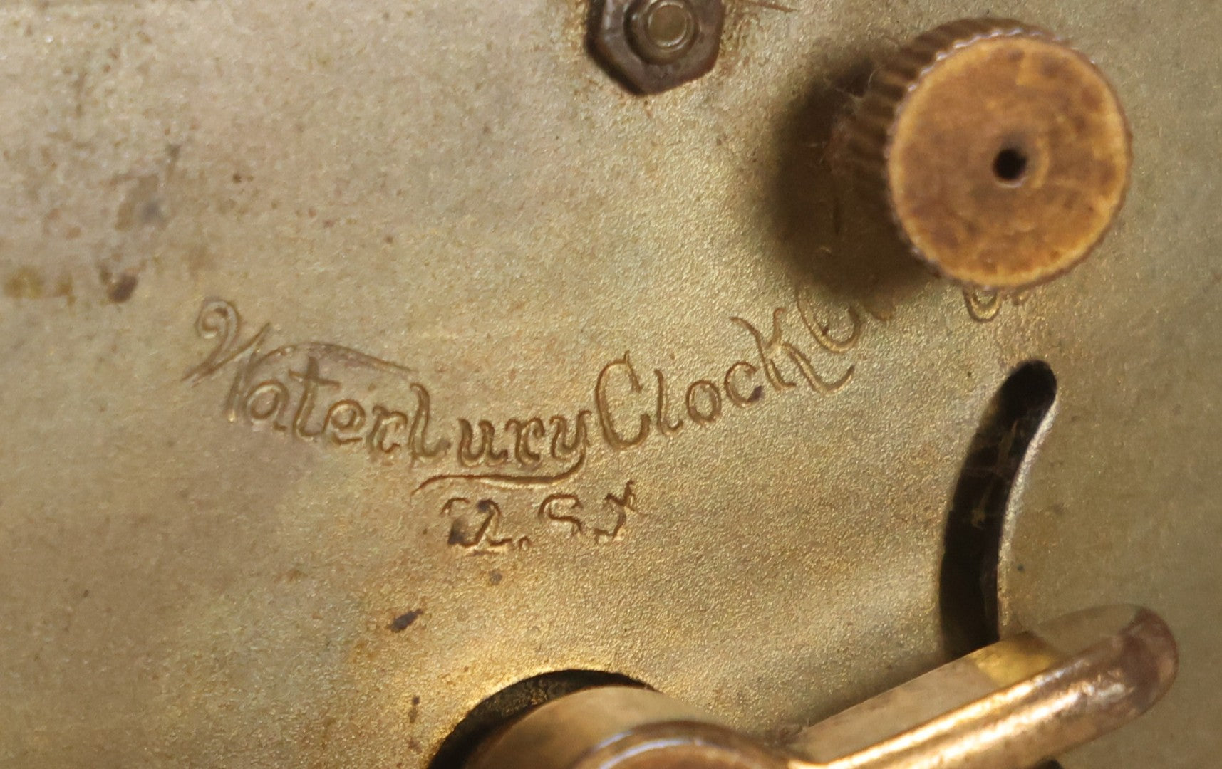 Lot 012 - Antique Waterbury Clock Co. Gold-Painted Spelter Mantel Clock With Hand-Painted Dial And Cupid Scene Panel, Circa 1890s Working Condition, 11" H