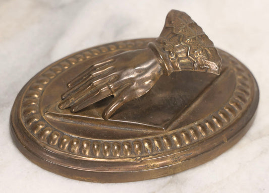 Lot 013 - Antique Pressed Brass Hand-Form Paperweight Clip On Weighted Oval Base, Circa Late 19th Century