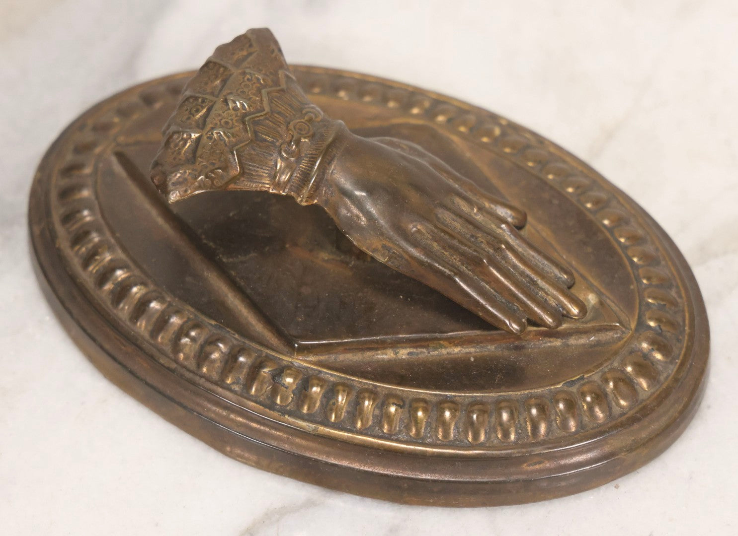 Lot 013 - Antique Pressed Brass Hand-Form Paperweight Clip On Weighted Oval Base, Circa Late 19th Century
