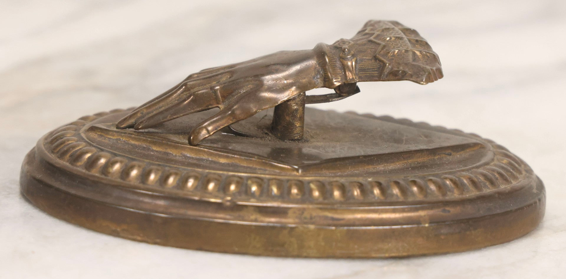 Lot 013 - Antique Pressed Brass Hand-Form Paperweight Clip On Weighted Oval Base, Circa Late 19th Century