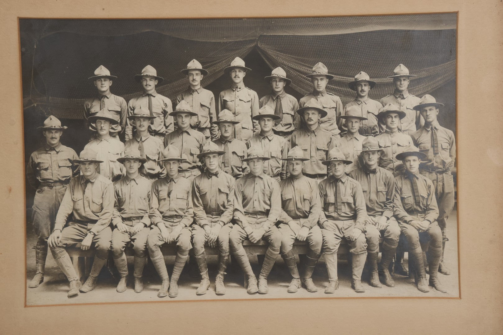 Lot 016 - Antique Boareded Photograph Of U.S. Army Soldiers In Early World War I Service Uniforms With Campaign Hats, Circa 1917–1918, In Frame, 17-5/8" x 13-5/8"