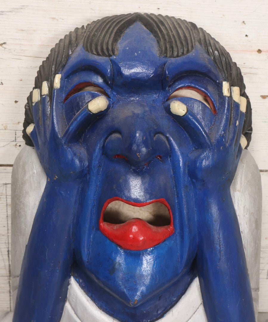 Lot 019 - Vintage Hand-Carved Folk Art Wooden Mask Depicting Blue Man With Hands To Face, Painted Finish, 12-1/4" x 16-3/4"