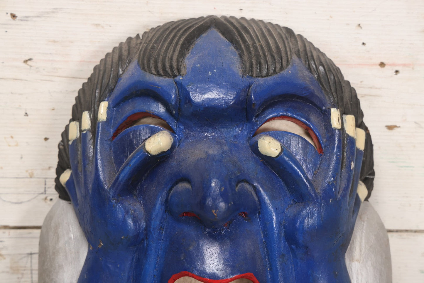 Lot 019 - Vintage Hand-Carved Folk Art Wooden Mask Depicting Blue Man With Hands To Face, Painted Finish, 12-1/4" x 16-3/4"