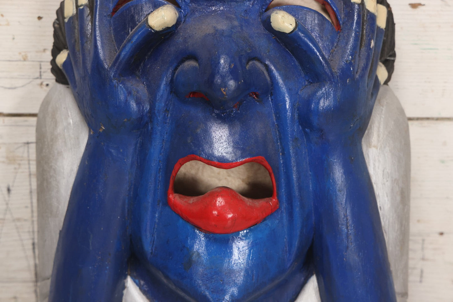 Lot 019 - Vintage Hand-Carved Folk Art Wooden Mask Depicting Blue Man With Hands To Face, Painted Finish, 12-1/4" x 16-3/4"