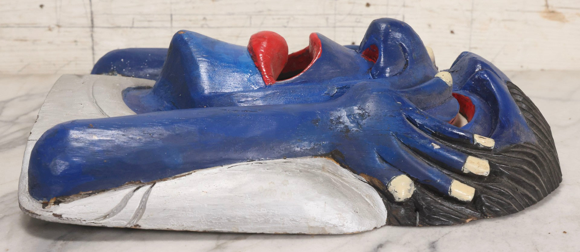 Lot 019 - Vintage Hand-Carved Folk Art Wooden Mask Depicting Blue Man With Hands To Face, Painted Finish, 12-1/4" x 16-3/4"