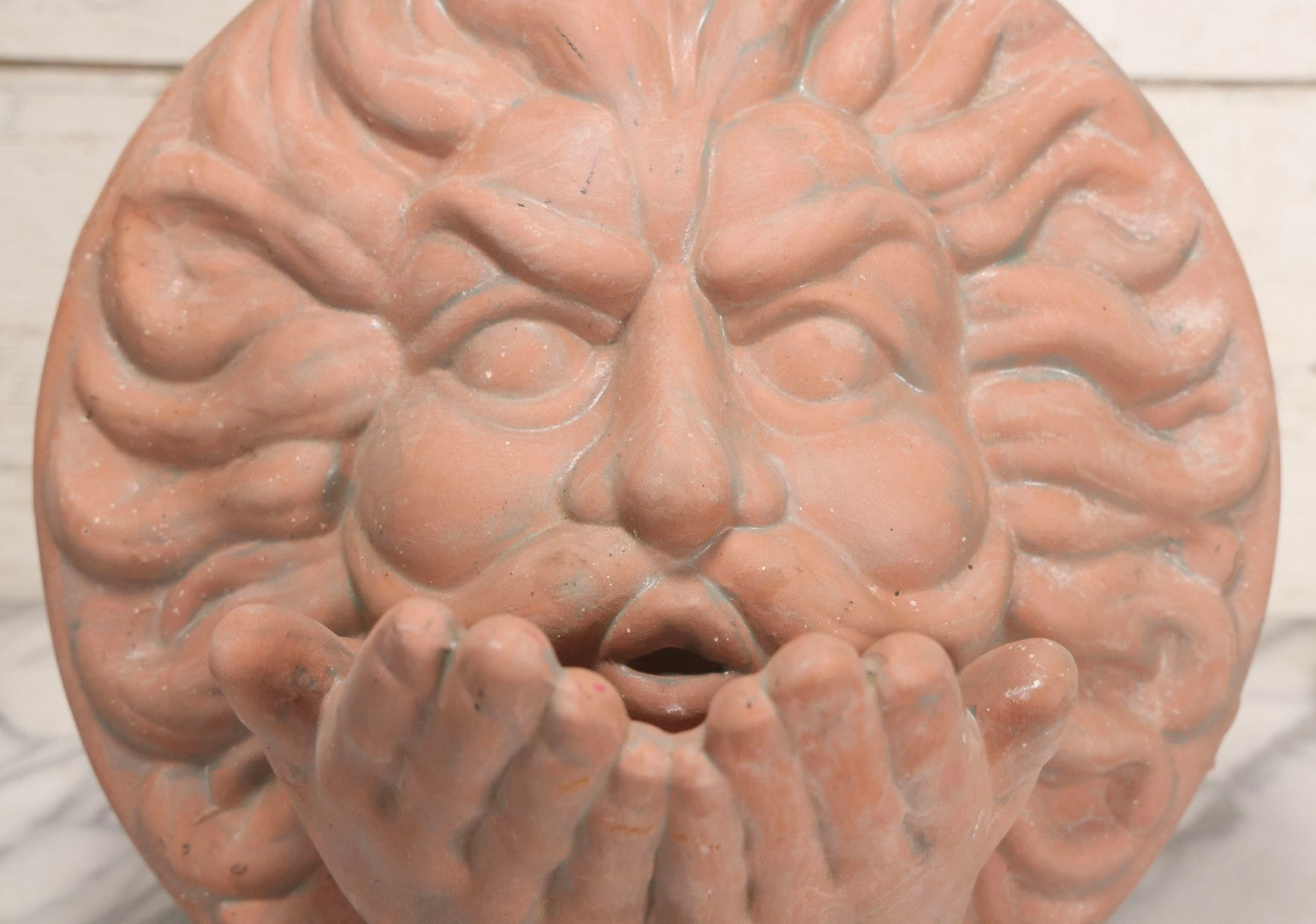 Lot 020 - Vintage Unglazed Ceramic Greenman Wall Plaque With Relief Face Blowing Over Pair Of Hands, Cold-Painted Surface, Marked "B P" On Verso, 13-3/4" Diameter