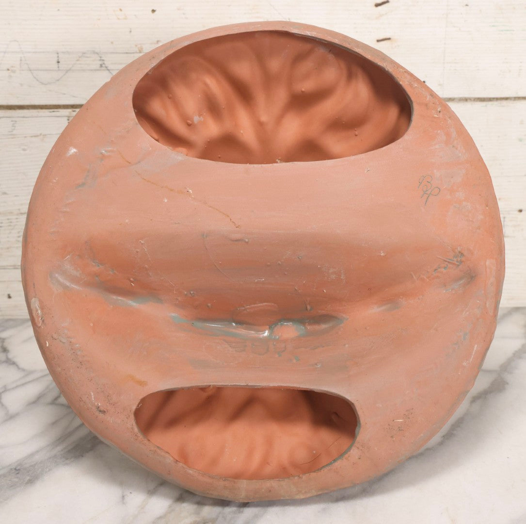 Lot 020 - Vintage Unglazed Ceramic Greenman Wall Plaque With Relief Face Blowing Over Pair Of Hands, Cold-Painted Surface, Marked "B P" On Verso, 13-3/4" Diameter