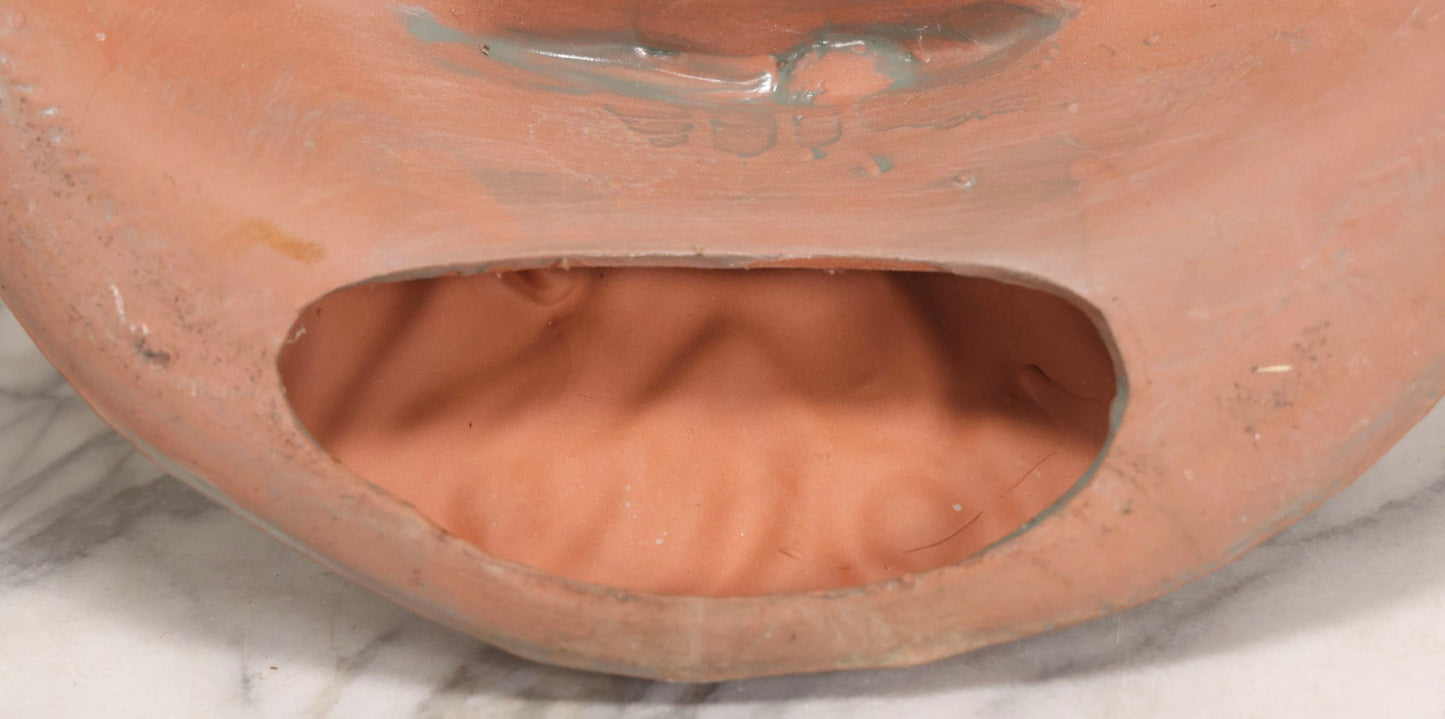 Lot 020 - Vintage Unglazed Ceramic Greenman Wall Plaque With Relief Face Blowing Over Pair Of Hands, Cold-Painted Surface, Marked "B P" On Verso, 13-3/4" Diameter