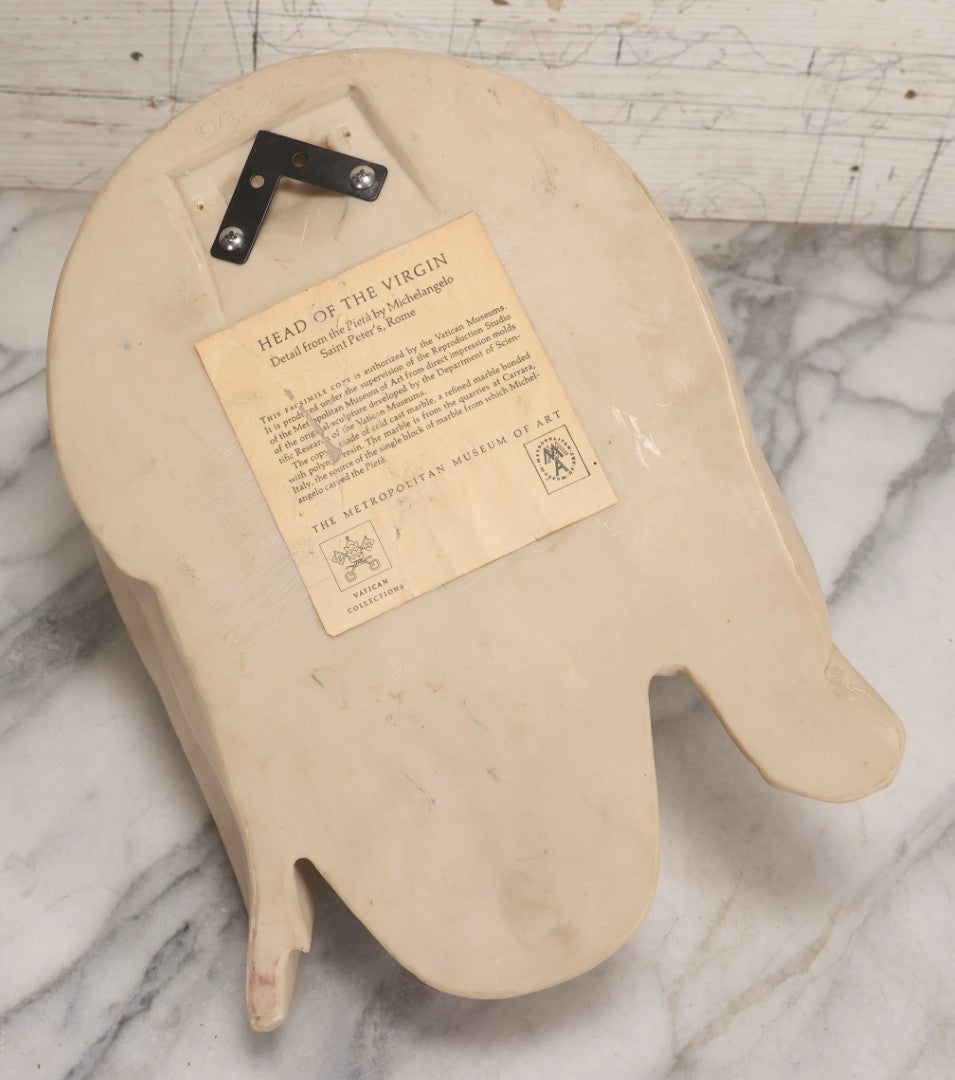 Lot 022 - Vintage Cold Cast Composite Polymer And Marble Wall Sculpture "Head Of The Virgin," Authorized Reproduction Of Michelangelo's Pietà By The Metropolitan Museum Of Art And Vatican Museums, Note Chip To Veil, 13-1/4" H