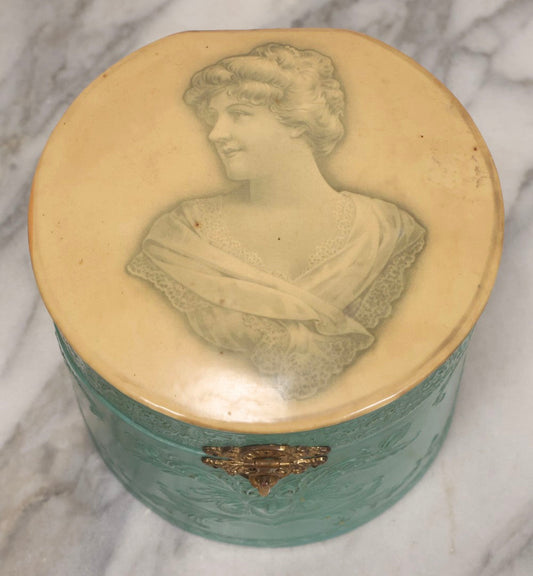 Lot 028 - Antique Blue-Green And White Celluloid Collar Box With Printed Portrait Of Woman, Pink Fabric Lining, And Arrow Cluett Peabody & Co. Collar, 6" H