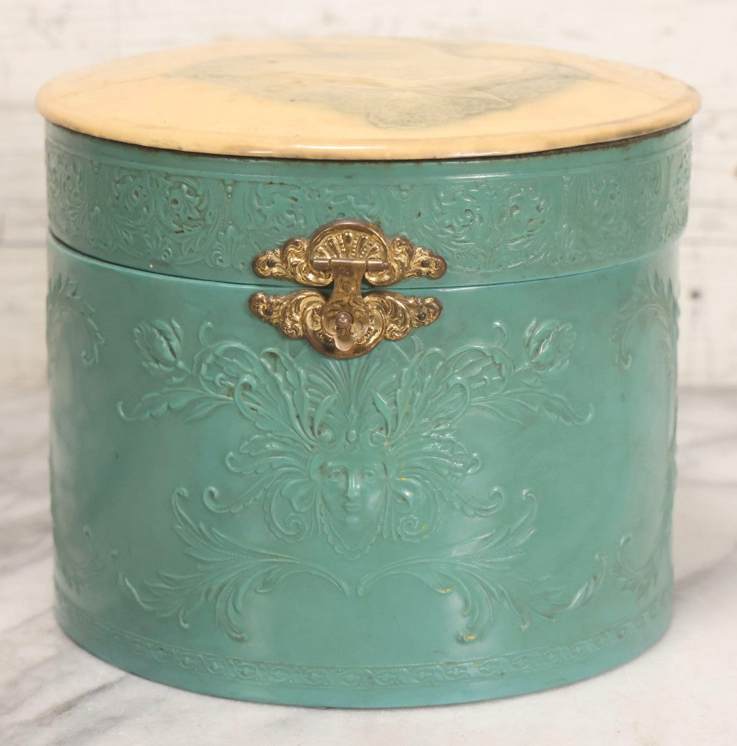 Lot 028 - Antique Blue-Green And White Celluloid Collar Box With Printed Portrait Of Woman, Pink Fabric Lining, And Arrow Cluett Peabody & Co. Collar, 6" H