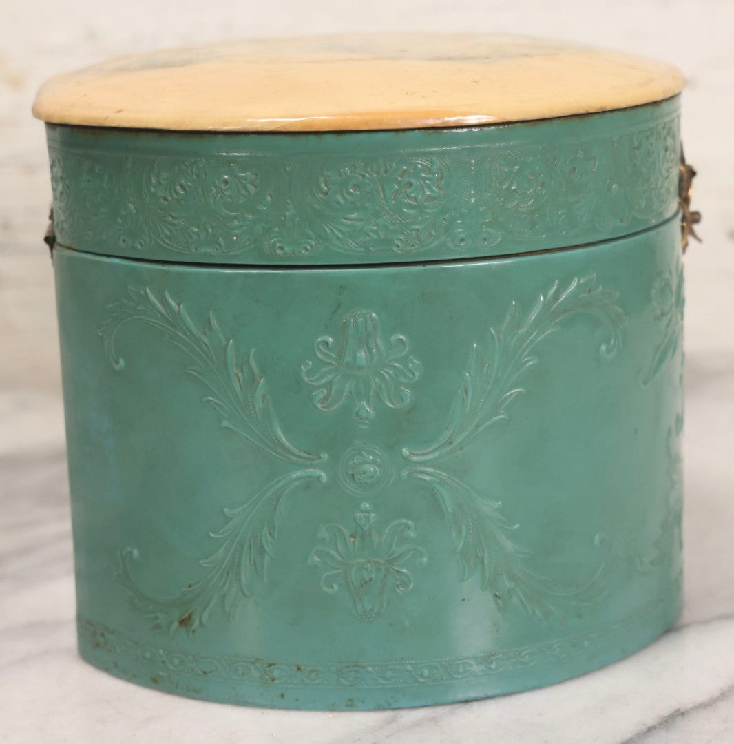 Lot 028 - Antique Blue-Green And White Celluloid Collar Box With Printed Portrait Of Woman, Pink Fabric Lining, And Arrow Cluett Peabody & Co. Collar, 6" H