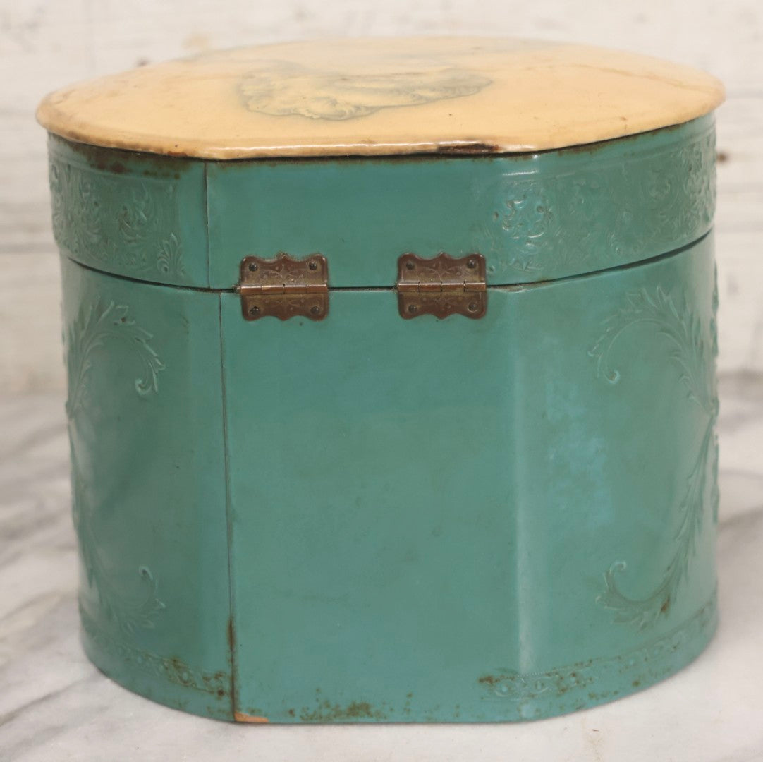Lot 028 - Antique Blue-Green And White Celluloid Collar Box With Printed Portrait Of Woman, Pink Fabric Lining, And Arrow Cluett Peabody & Co. Collar, 6" H