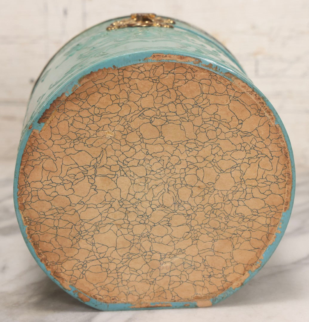 Lot 028 - Antique Blue-Green And White Celluloid Collar Box With Printed Portrait Of Woman, Pink Fabric Lining, And Arrow Cluett Peabody & Co. Collar, 6" H