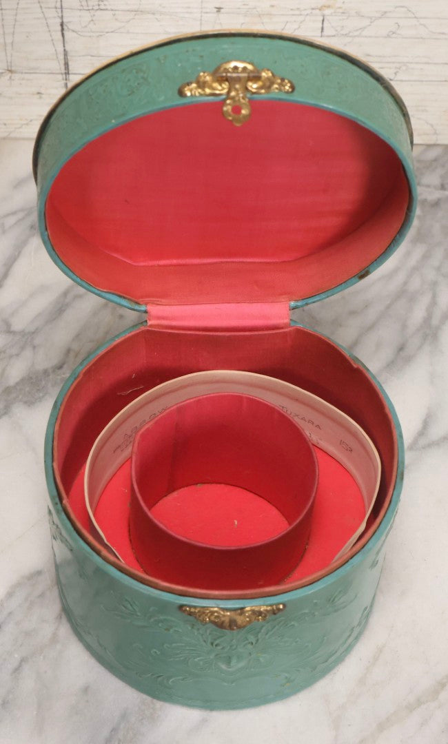 Lot 028 - Antique Blue-Green And White Celluloid Collar Box With Printed Portrait Of Woman, Pink Fabric Lining, And Arrow Cluett Peabody & Co. Collar, 6" H