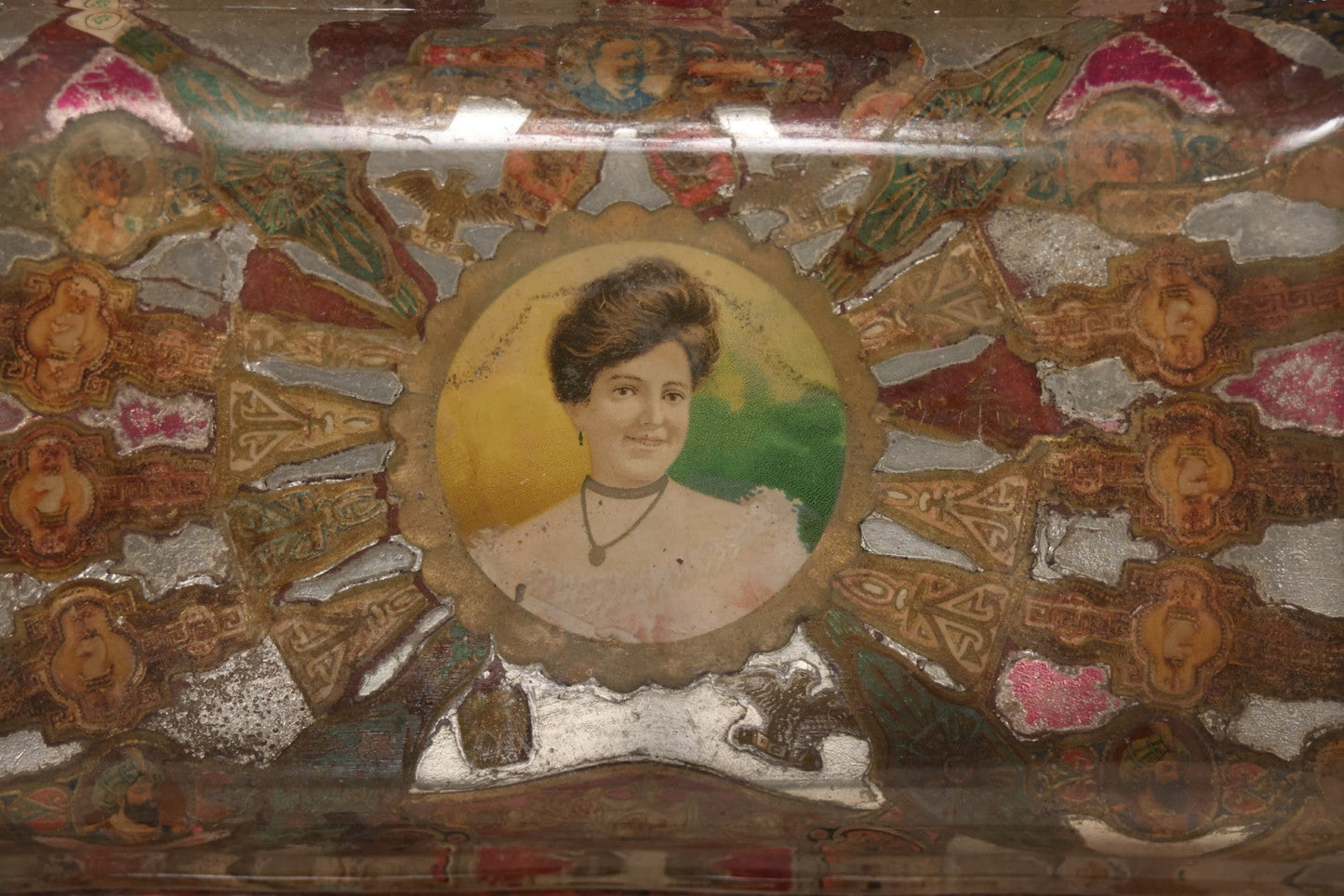 Lot 031 - Antique Reverse Painted And Collaged Cigar Bands Glass Tray With Portrait Of Woman And Red Felt Backing, 8-7/8" x 5"