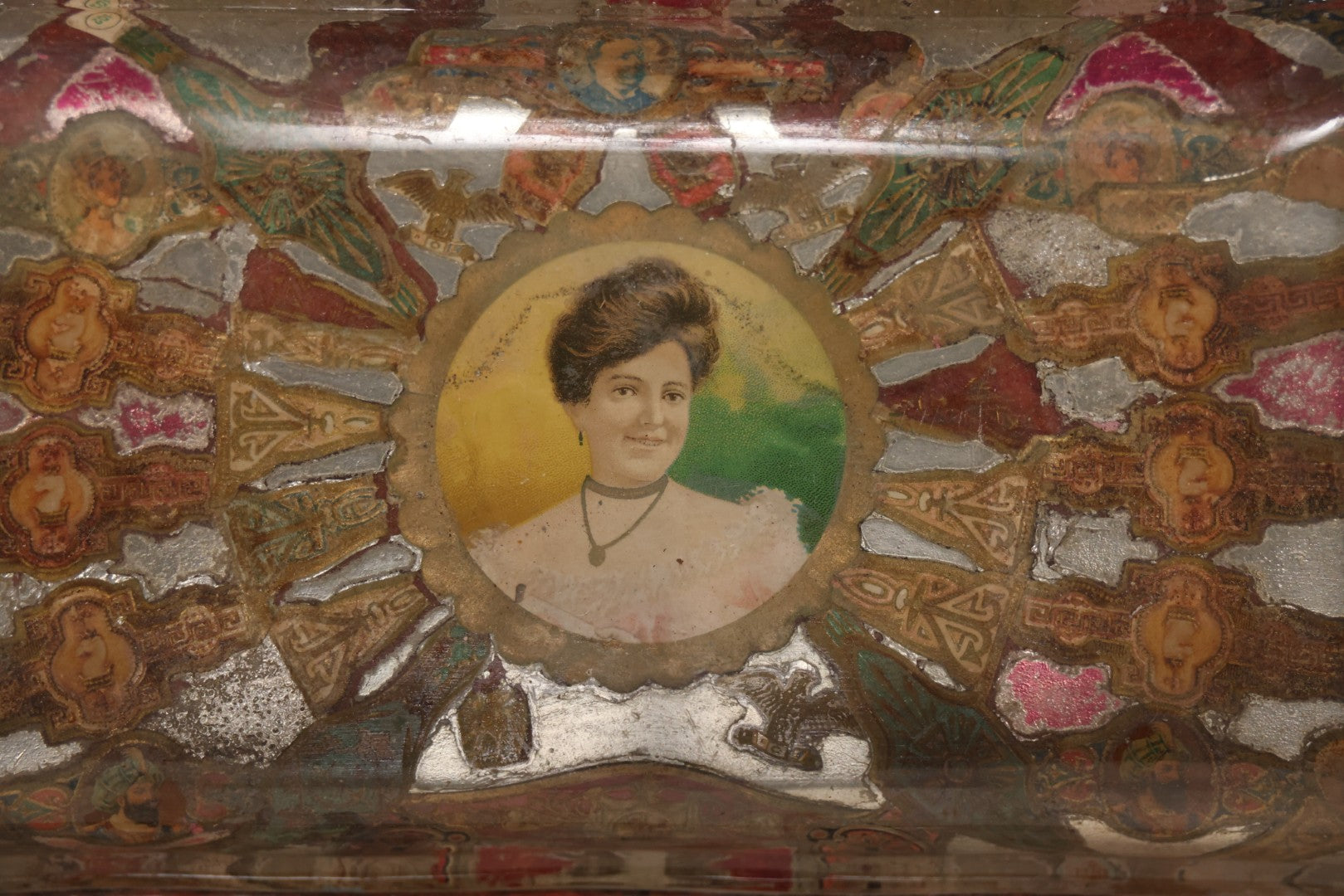 Lot 031 - Antique Reverse Painted And Collaged Cigar Bands Glass Tray With Portrait Of Woman And Red Felt Backing, 8-7/8" x 5"