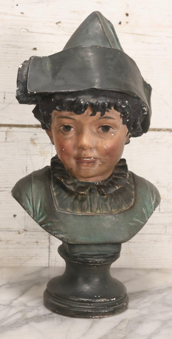 Lot 032 - Antique Hand Painted Chalkware Bust Of Boy In Green Ruffle Collared Shirt And Folded Paper Style Hat With Black Band And Green Top, 15" H