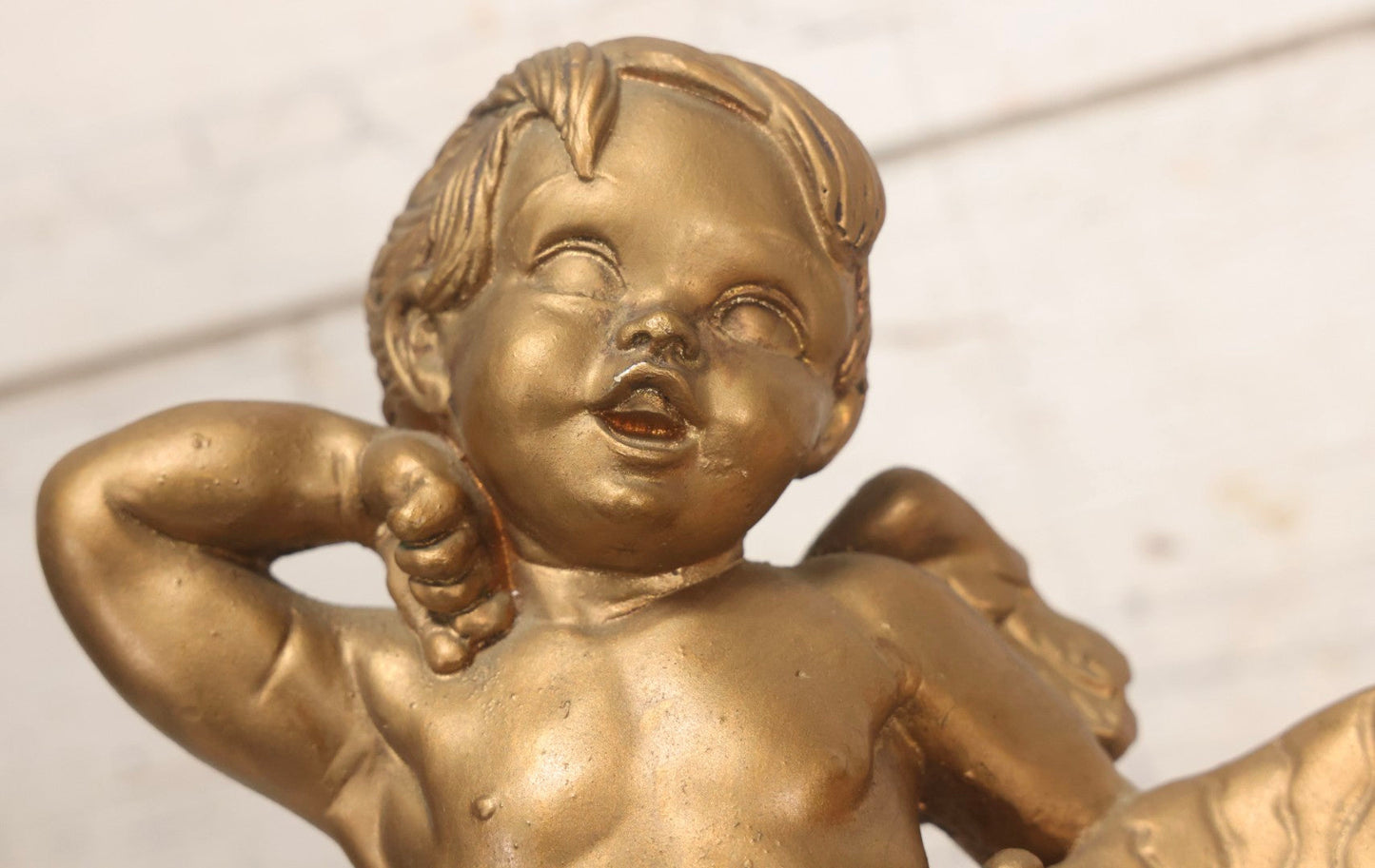 Lot 034 - Vintage Gold-Painted Chalkware Statue Of Yawning Cupid With Grapes, Vines, And Crab Motif, 11-3/4" H