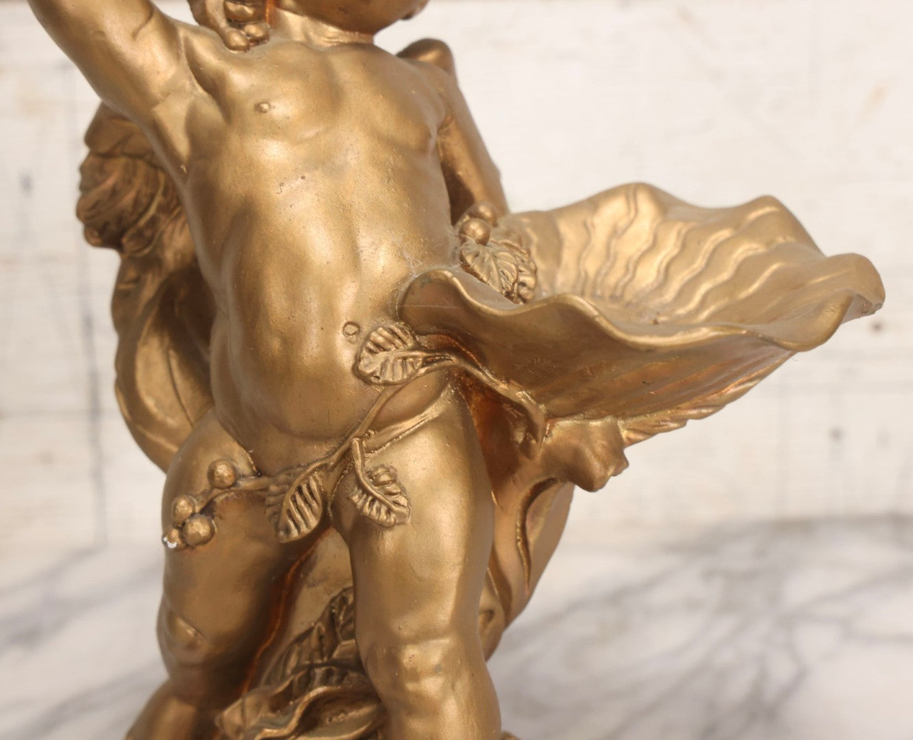 Lot 034 - Vintage Gold-Painted Chalkware Statue Of Yawning Cupid With Grapes, Vines, And Crab Motif, 11-3/4" H