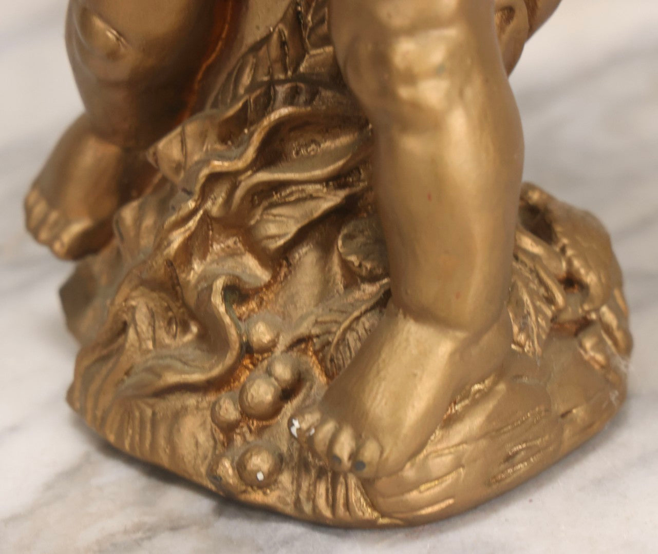 Lot 034 - Vintage Gold-Painted Chalkware Statue Of Yawning Cupid With Grapes, Vines, And Crab Motif, 11-3/4" H