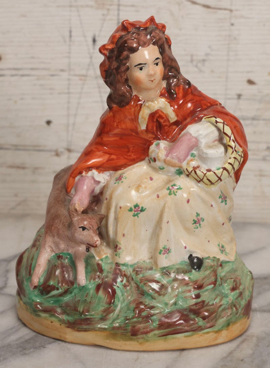 Lot 036 - Antique Staffordshire Porcelain Figure Of Girl In Red Hood With Basket And Dog, Possibly Little Red Riding Hood, 7-1/2" H