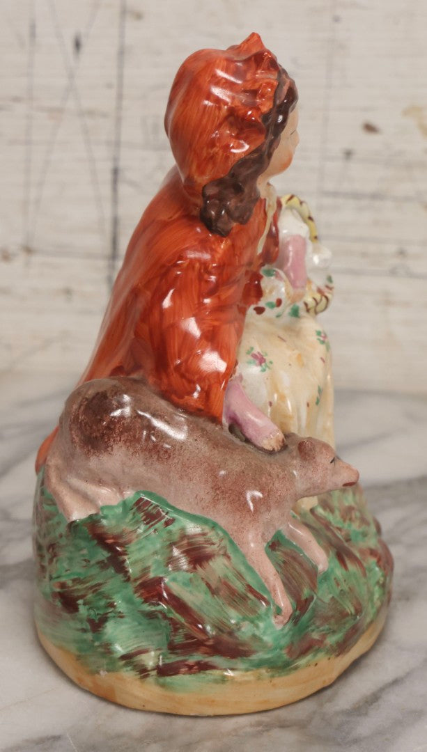 Lot 036 - Antique Staffordshire Porcelain Figure Of Girl In Red Hood With Basket And Dog, Possibly Little Red Riding Hood, 7-1/2" H