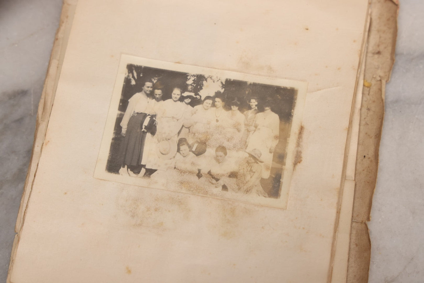 Lot 040 - Antique "Kewpie Book" Snapshot Photo Album And Scrapbook Of Johanna Cecile Powell, Hand-Painted Cover With Rose O'Neill-Style Kewpies, Containing Notes, Photographs, And Ephemera From The “Kewpie Klub,” Stetson University, Circa 1917–1920