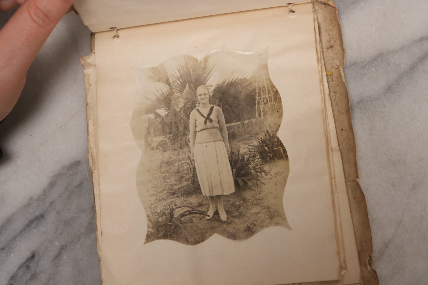 Lot 040 - Antique "Kewpie Book" Snapshot Photo Album And Scrapbook Of Johanna Cecile Powell, Hand-Painted Cover With Rose O'Neill-Style Kewpies, Containing Notes, Photographs, And Ephemera From The “Kewpie Klub,” Stetson University, Circa 1917–1920