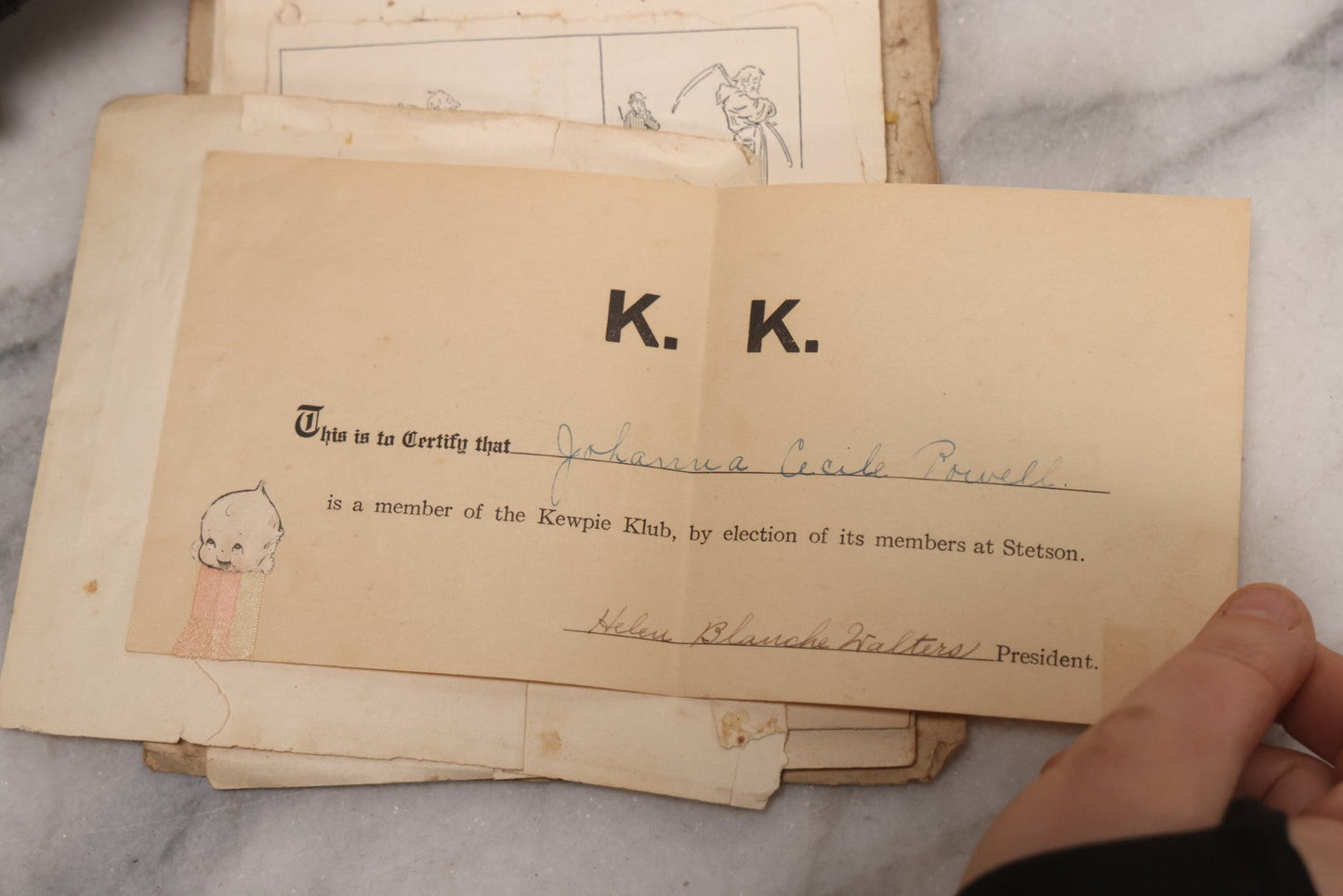 Lot 040 - Antique "Kewpie Book" Snapshot Photo Album And Scrapbook Of Johanna Cecile Powell, Hand-Painted Cover With Rose O'Neill-Style Kewpies, Containing Notes, Photographs, And Ephemera From The “Kewpie Klub,” Stetson University, Circa 1917–1920