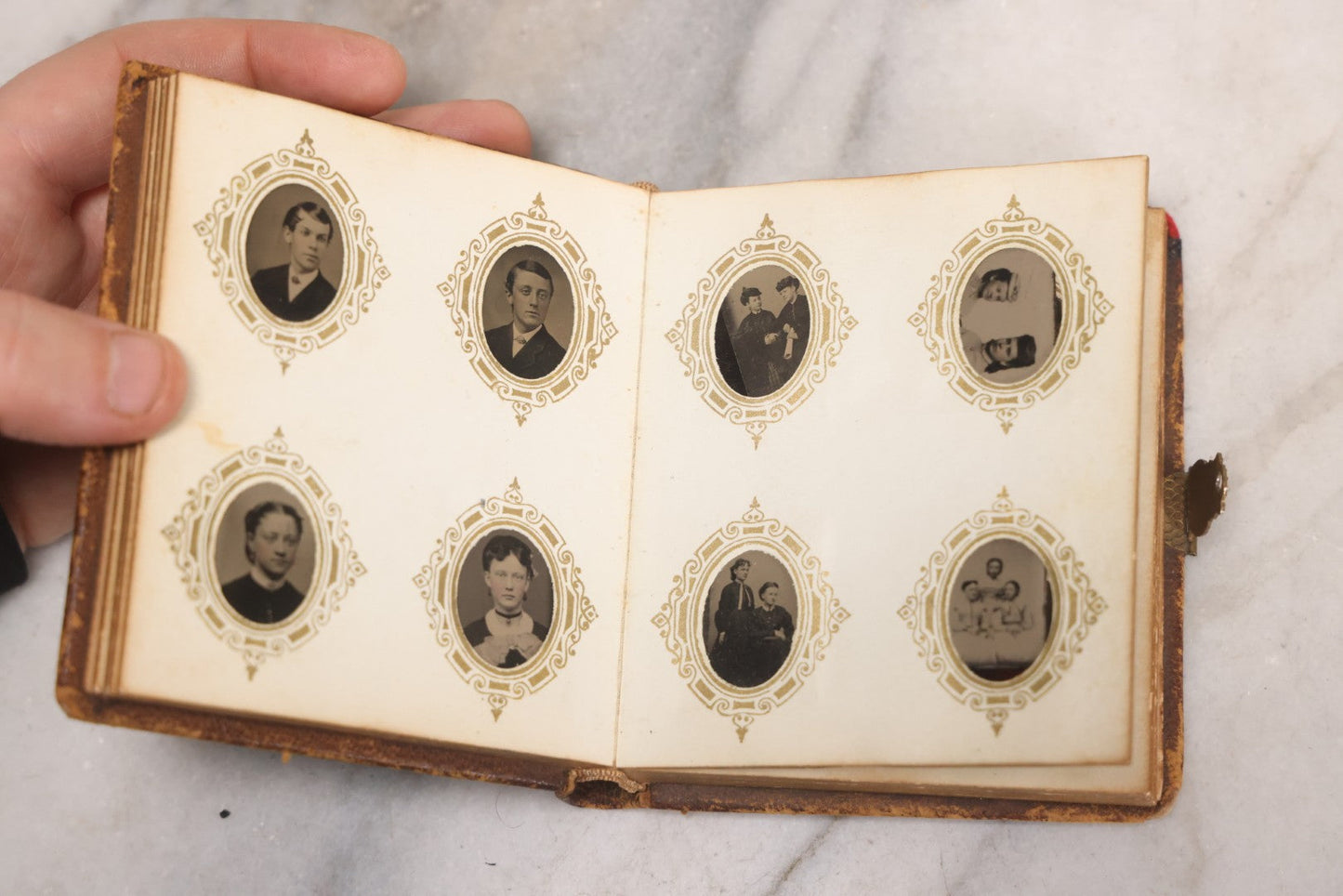 Lot 041 - Antique Complete Gem Tintype Photo Album Containing 96 Images On 12 Double-Sided Pages, Including Boy With Dog, Group And Pair Portraits, And Finely Executed Individual Studies