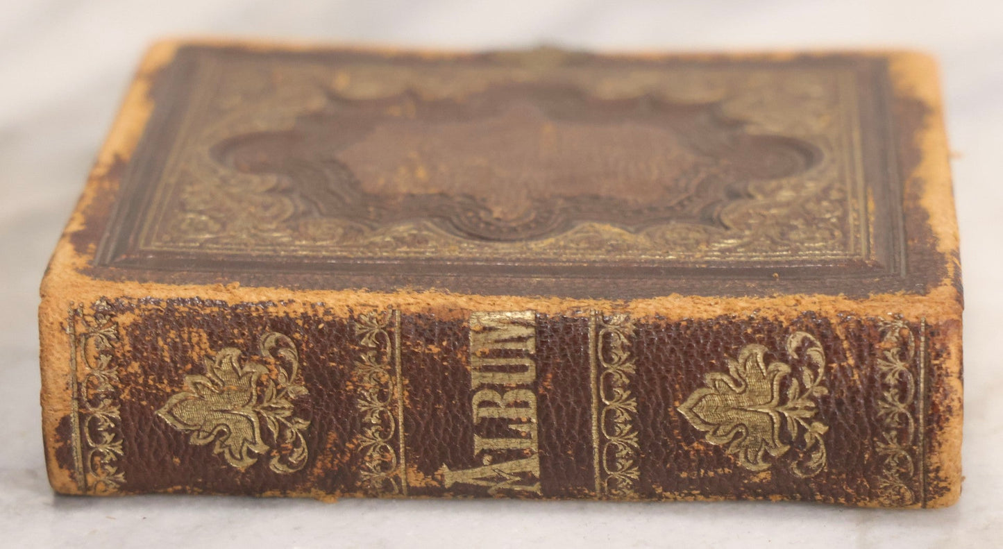 Lot 041 - Antique Complete Gem Tintype Photo Album Containing 96 Images On 12 Double-Sided Pages, Including Boy With Dog, Group And Pair Portraits, And Finely Executed Individual Studies