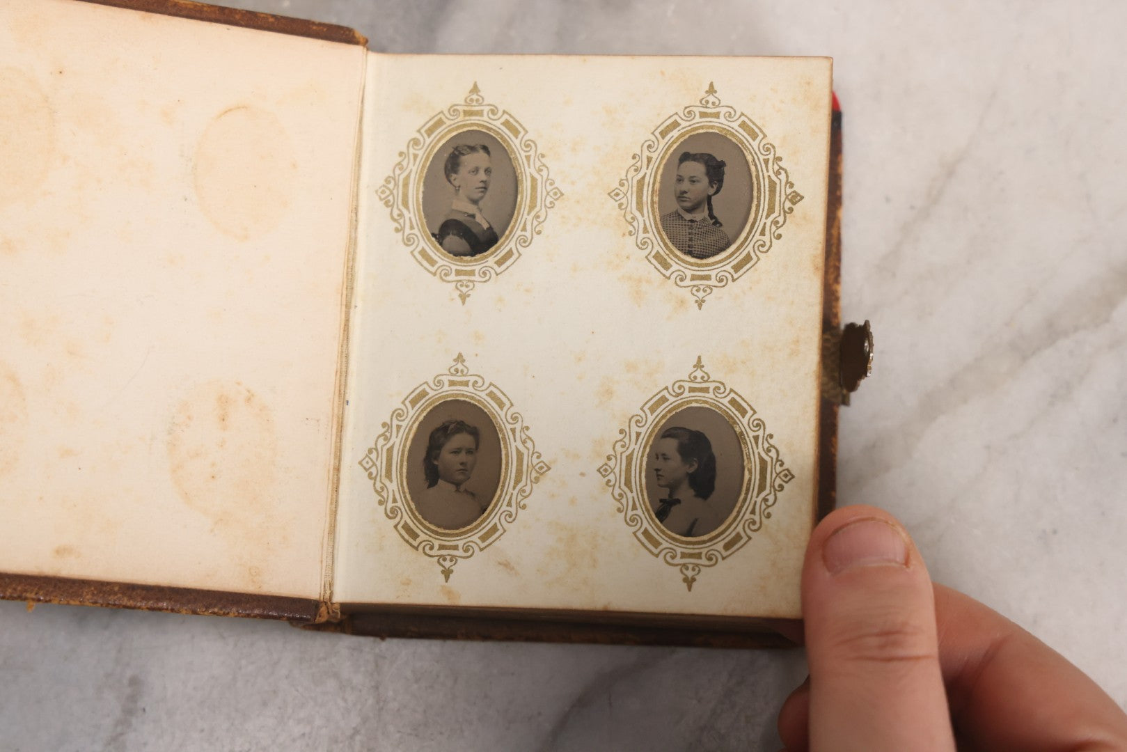 Lot 041 - Antique Complete Gem Tintype Photo Album Containing 96 Images On 12 Double-Sided Pages, Including Boy With Dog, Group And Pair Portraits, And Finely Executed Individual Studies