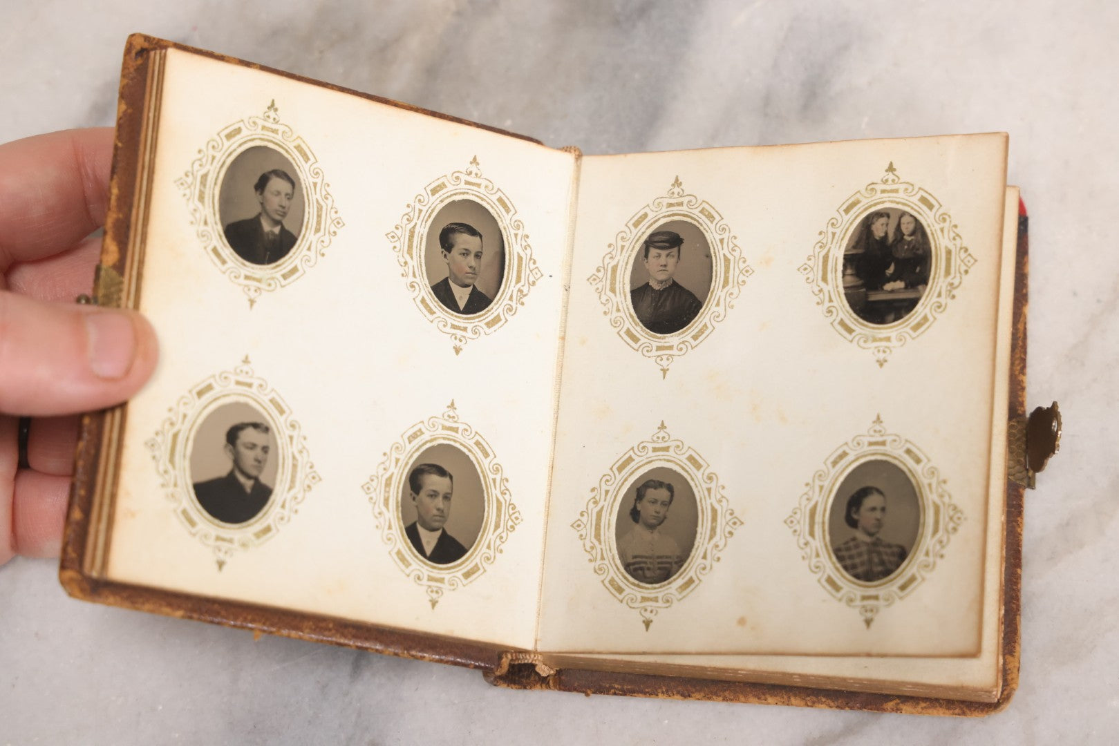 Lot 041 - Antique Complete Gem Tintype Photo Album Containing 96 Images On 12 Double-Sided Pages, Including Boy With Dog, Group And Pair Portraits, And Finely Executed Individual Studies
