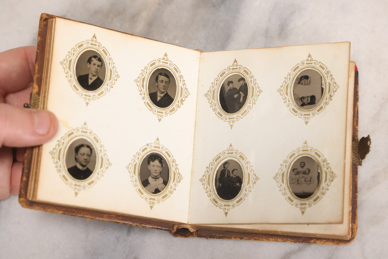 Lot 041 - Antique Complete Gem Tintype Photo Album Containing 96 Images On 12 Double-Sided Pages, Including Boy With Dog, Group And Pair Portraits, And Finely Executed Individual Studies