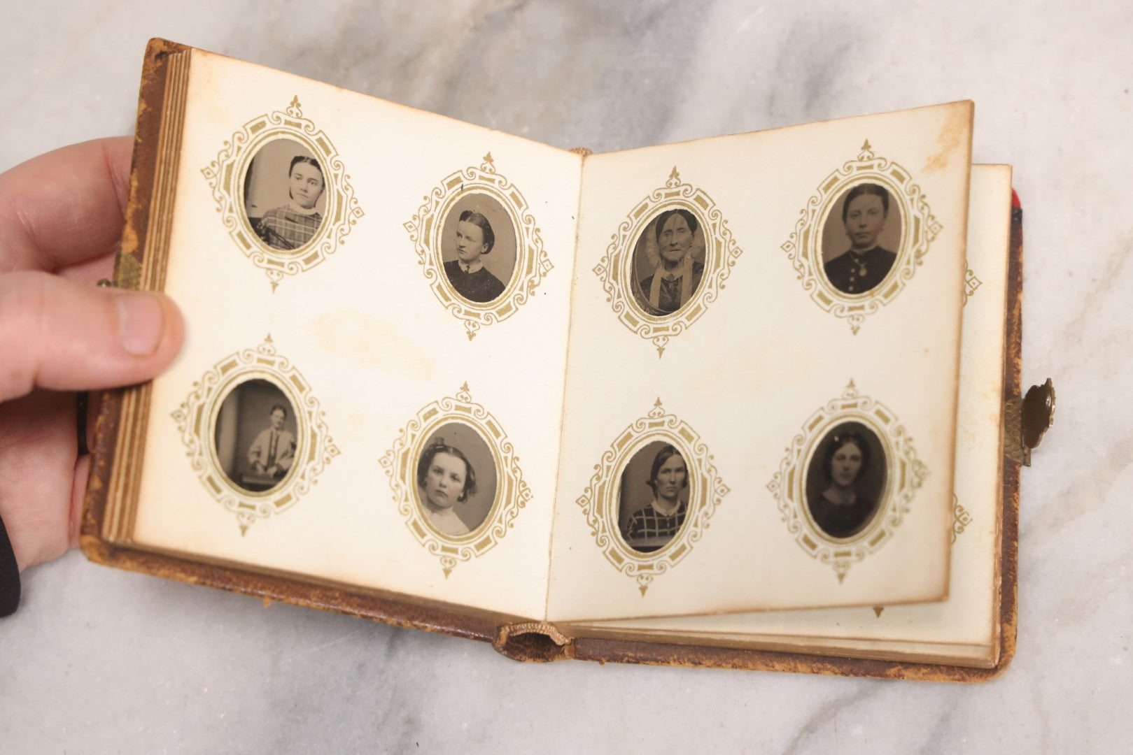 Lot 041 - Antique Complete Gem Tintype Photo Album Containing 96 Images On 12 Double-Sided Pages, Including Boy With Dog, Group And Pair Portraits, And Finely Executed Individual Studies