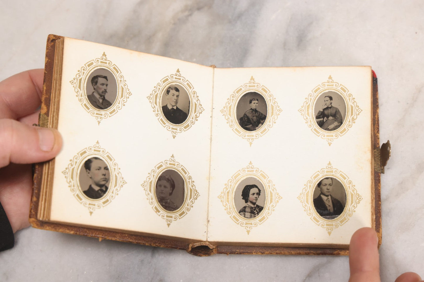 Lot 041 - Antique Complete Gem Tintype Photo Album Containing 96 Images On 12 Double-Sided Pages, Including Boy With Dog, Group And Pair Portraits, And Finely Executed Individual Studies