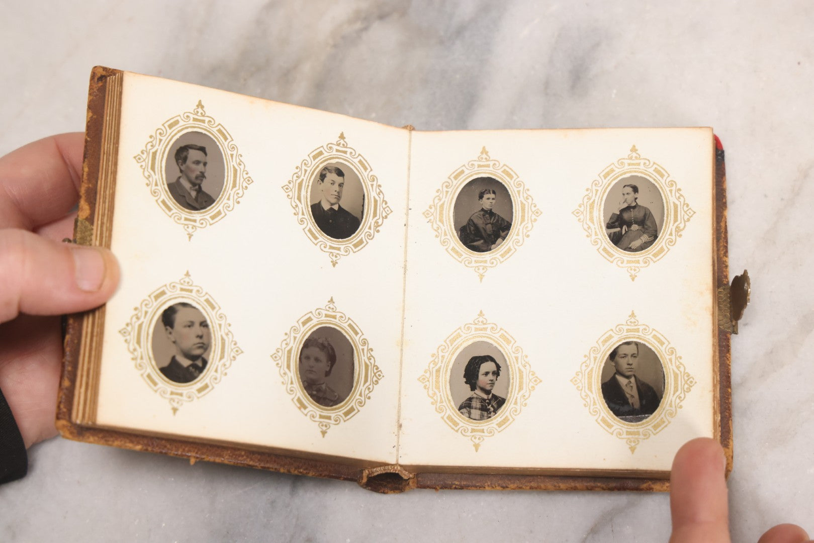 Lot 041 - Antique Complete Gem Tintype Photo Album Containing 96 Images On 12 Double-Sided Pages, Including Boy With Dog, Group And Pair Portraits, And Finely Executed Individual Studies