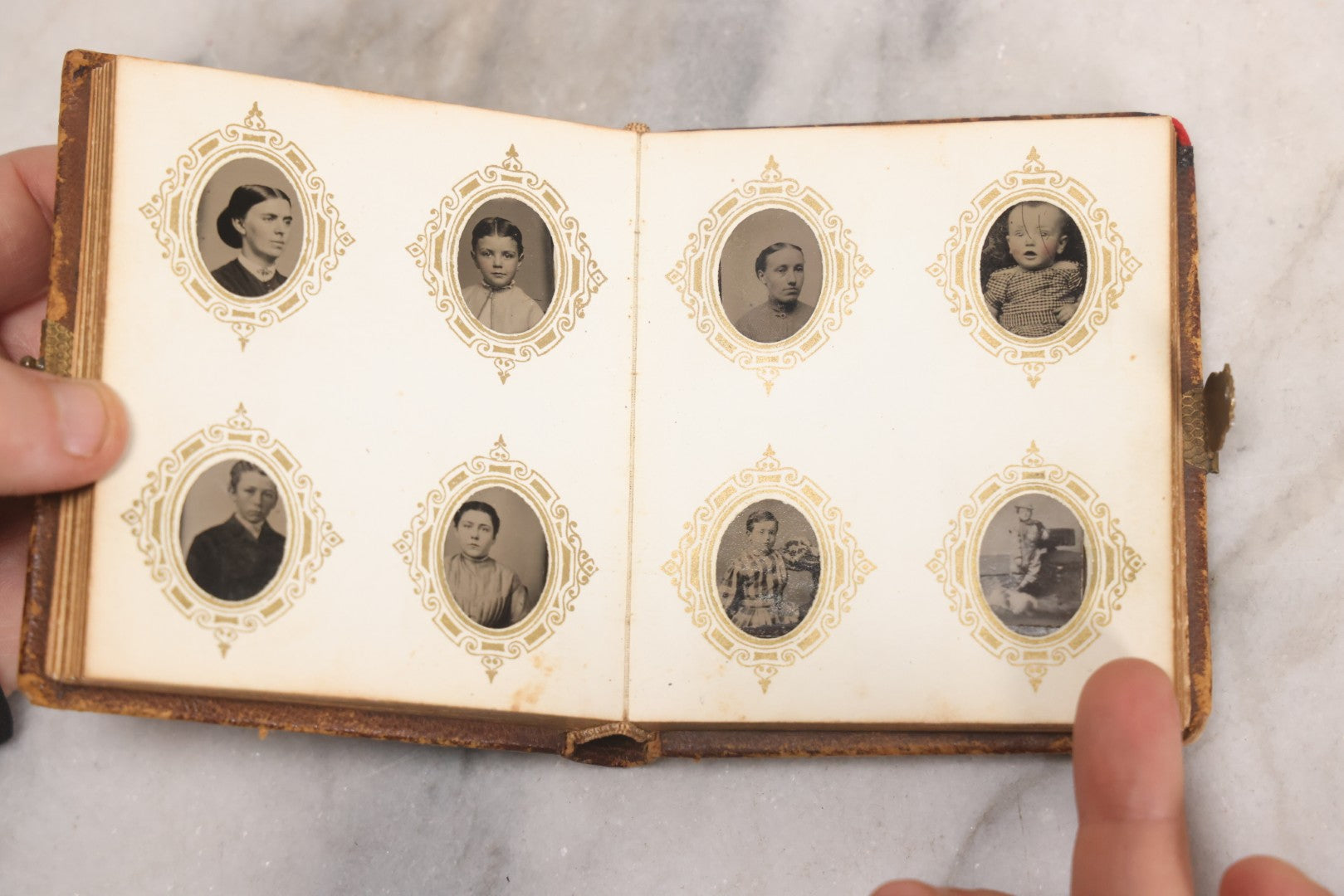 Lot 041 - Antique Complete Gem Tintype Photo Album Containing 96 Images On 12 Double-Sided Pages, Including Boy With Dog, Group And Pair Portraits, And Finely Executed Individual Studies
