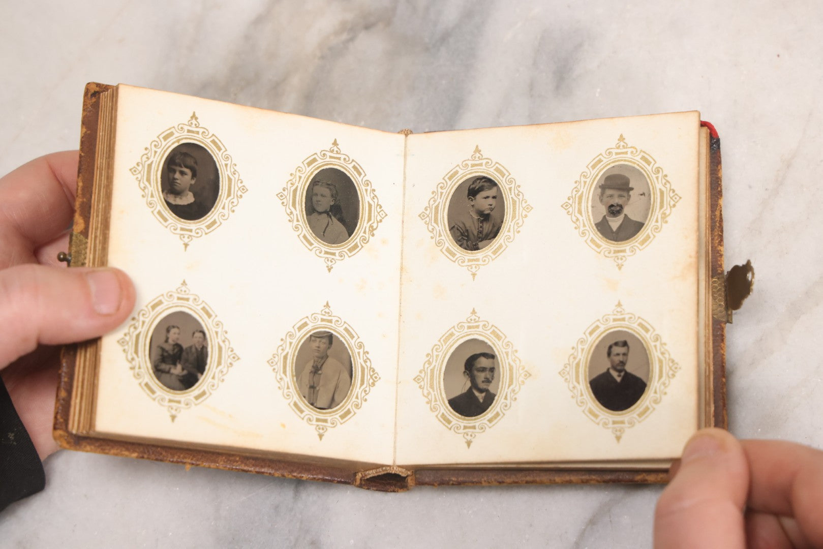 Lot 041 - Antique Complete Gem Tintype Photo Album Containing 96 Images On 12 Double-Sided Pages, Including Boy With Dog, Group And Pair Portraits, And Finely Executed Individual Studies
