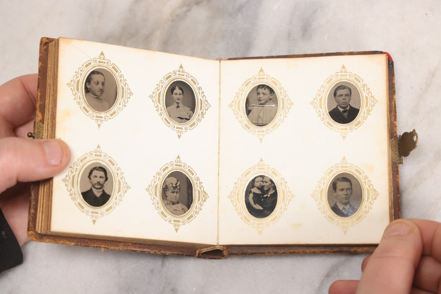 Lot 041 - Antique Complete Gem Tintype Photo Album Containing 96 Images On 12 Double-Sided Pages, Including Boy With Dog, Group And Pair Portraits, And Finely Executed Individual Studies