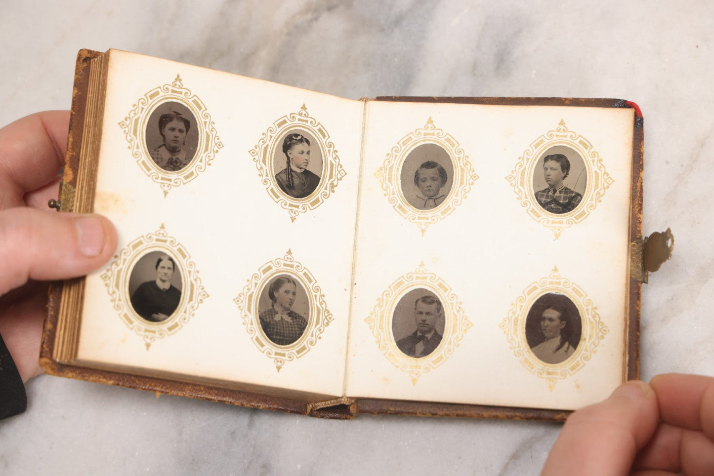 Lot 041 - Antique Complete Gem Tintype Photo Album Containing 96 Images On 12 Double-Sided Pages, Including Boy With Dog, Group And Pair Portraits, And Finely Executed Individual Studies